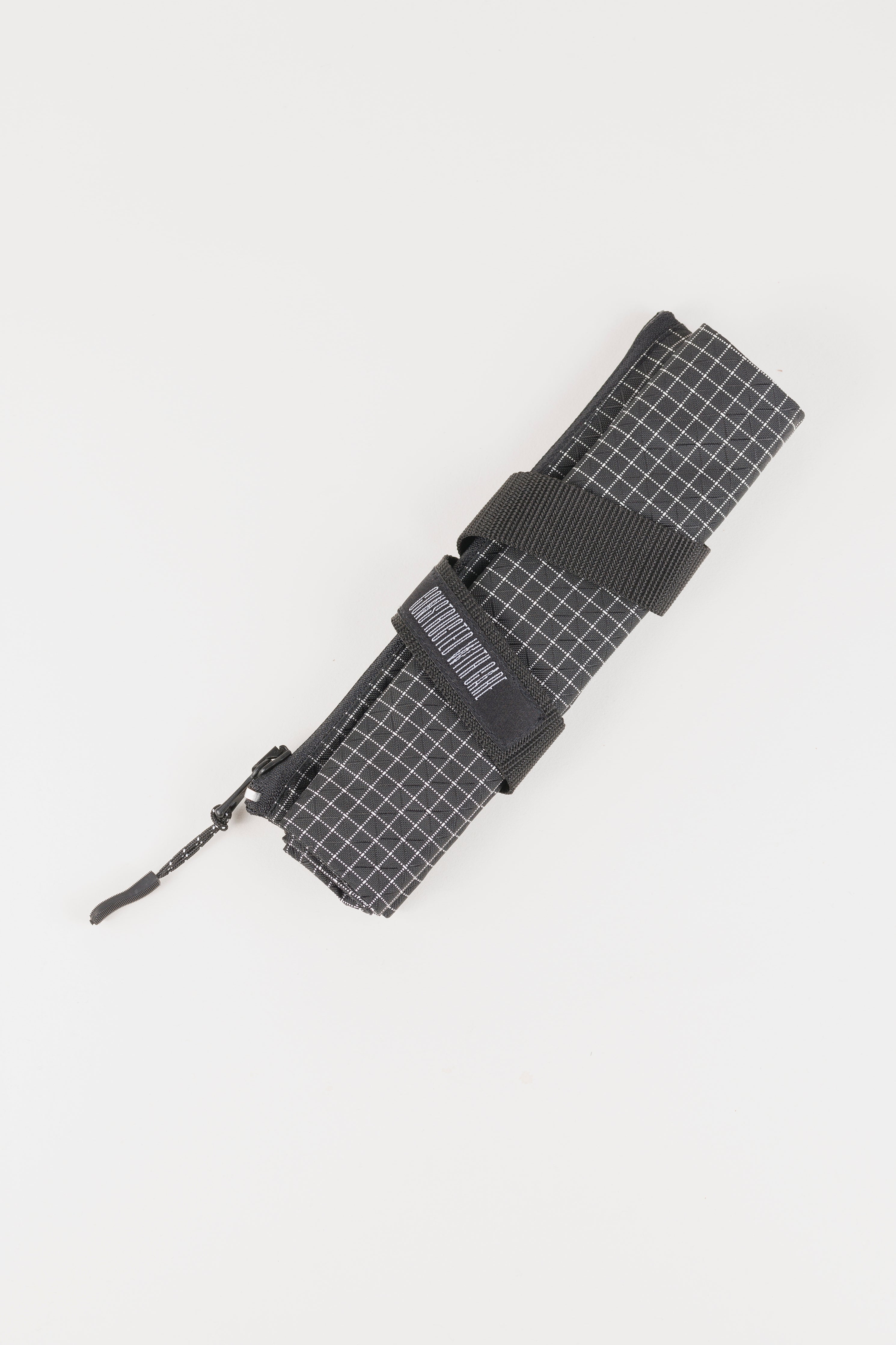 Ennio roll pouch — black grid